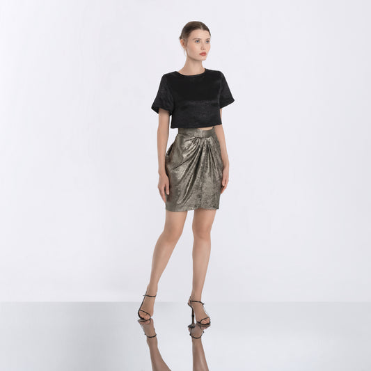 Metallic gold pleated skirt with sculptural silhouette and elegant shine, part of Lola Clavel's designer womenswear collection