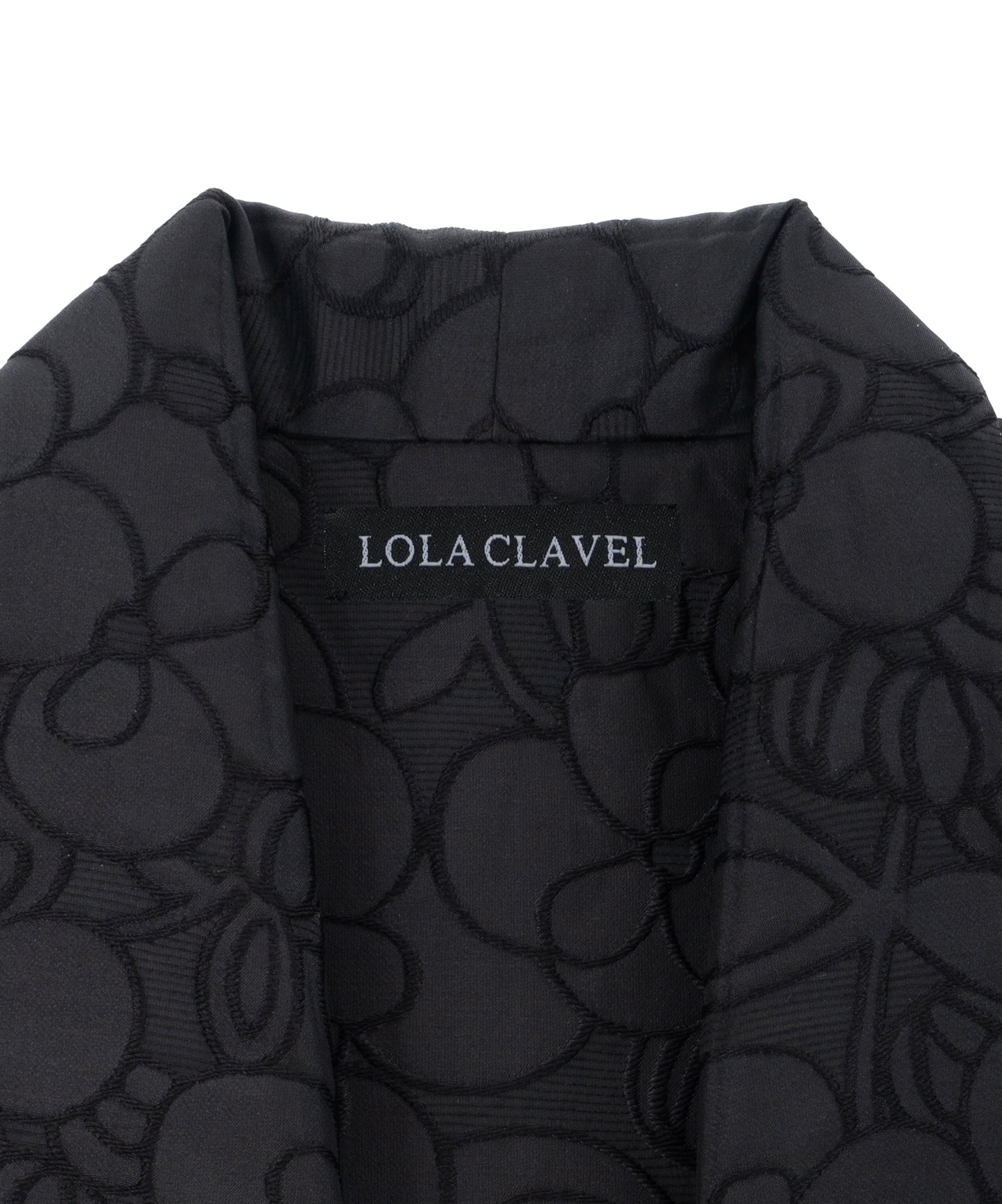 Lining detail with label lola clavel